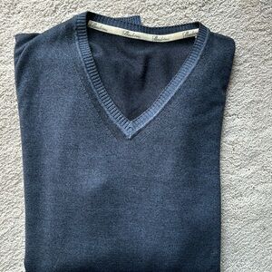 Stenströms blue with lighter blue trim vee neck sweater.